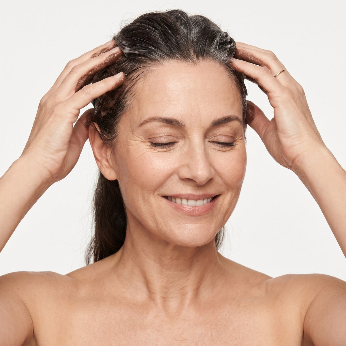 Woman massaging her hairline